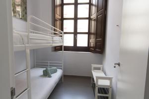 Postel nebo postele na pokoji v ubytování Apartamentos Málaga Picasso