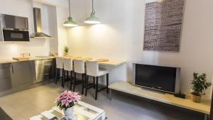 Kuchyň nebo kuchyňský kout v ubytování Apartamentos Málaga Picasso