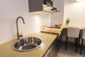 Kuchyň nebo kuchyňský kout v ubytování Apartamentos Málaga Picasso