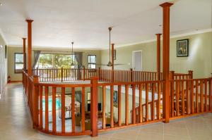 a largeoyer with a wooden staircase in a house at Surf Tropical Villa Seascape in Cerf Island