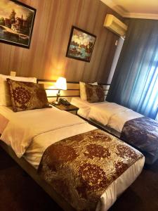 Кровать или кровати в номере Family Resort Hotel