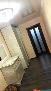 a room with a hallway with a door and a table at Apartments in the Center of the city in Dnipro