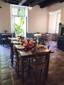 a large wooden table with chairs in a room at Auberge Lion D'Or in Saint-Antonin-Noble-Val +28 photos