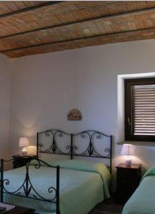 Posteľ alebo postele v izbe v ubytovaní Agriturismo Villa Luca