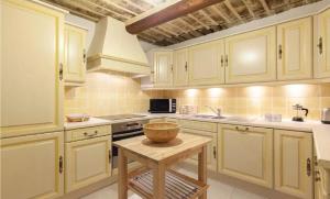 a kitchen with white cabinets and a bowl on a table at 2 bedrooms 2 bathrooms apartment in Old Antibes in Antibes