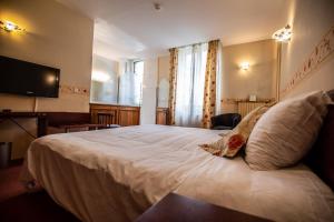 Letto o letti in una camera di Hôtel Terminus