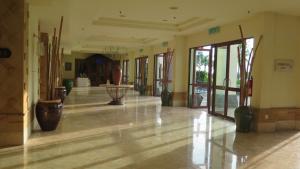 an empty hallway with vases in a building at Langkawi Lagoon Resort Water Chalet in Pantai Cenang +106 photos