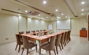 a large conference room with a long table and chairs at Unima Grand in Male City