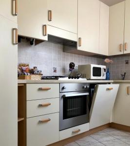 A kitchen or kitchenette at Appartamento Il Portico