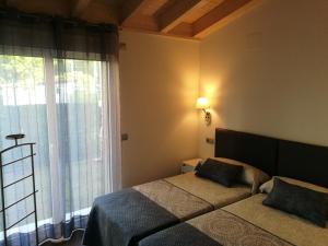 Postel nebo postele na pokoji v ubytování Apartamentos La Encina