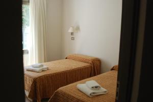 Tempat tidur dalam kamar di Hotel Savoia Mendoza