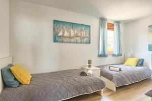 سرير أو أسرّة في غرفة في Apartment Peninsula