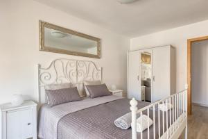 سرير أو أسرّة في غرفة في Apartment Peninsula