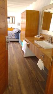 a bathroom with a sink and a mirror at Sierra Central By Chic Hotel Group in Tepoztlán