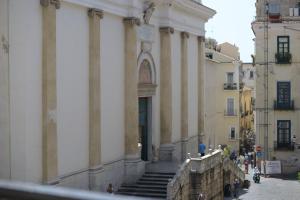 a building with stairs and people standing outside of it at Il Duomo Salerno in Salerno