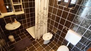 Ein Badezimmer in der Unterkunft Apartmani Laura