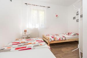 Posteľ alebo postele v izbe v ubytovaní Apartments Cekada