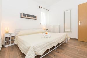 Posteľ alebo postele v izbe v ubytovaní Apartments Cekada