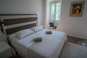 Postel nebo postele na pokoji v ubytování JR Luxury Guesthouse