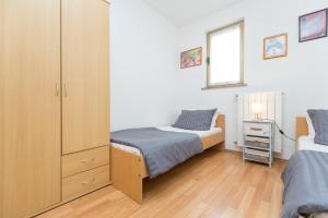 Posteľ alebo postele v izbe v ubytovaní Apartments Cekada