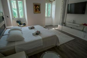 Postel nebo postele na pokoji v ubytování JR Luxury Guesthouse
