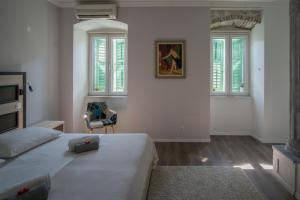 Postel nebo postele na pokoji v ubytování JR Luxury Guesthouse