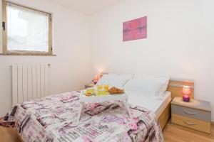 Posteľ alebo postele v izbe v ubytovaní Apartments Cekada