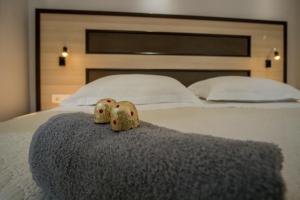 Postel nebo postele na pokoji v ubytování JR Luxury Guesthouse