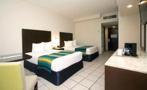 Postel nebo postele na pokoji v ubytování Crown Paradise Club Cancun - All Inclusive