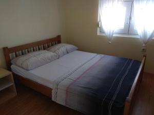 Łóżko lub łóżka w pokoju w obiekcie Apartment Bucic