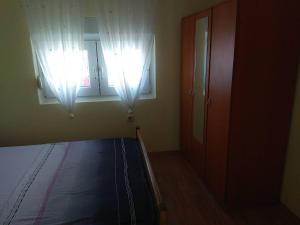 Łóżko lub łóżka w pokoju w obiekcie Apartment Bucic