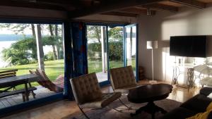a living room with a large sliding glass door with a view at Blue Bird in Pluski