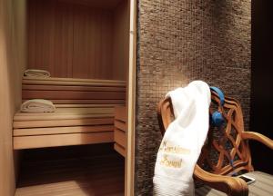a sauna with a towel hanging on a wall at La Maison Favart in Paris