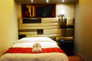 Katil atau katil-katil dalam bilik di Hotel Royal Qosqo