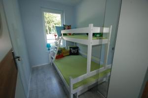 Postel nebo postele na pokoji v ubytování M&K Apartamenty Zielony Zakątek - Sobieszewo
