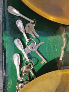 a group of metal keys on a chain at Villa Eugenia in Livorno