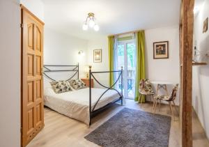 a bedroom with a bed and a window and a door at Hubertus Rewal in Rewal
