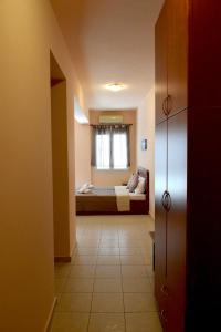 A bed or beds in a room at Arianna Studios 7