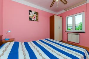 Postel nebo postele na pokoji v ubytování Apartments Luka