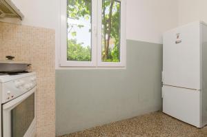 Kuchyň nebo kuchyňský kout v ubytování Apartments Luka