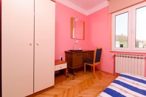 Postel nebo postele na pokoji v ubytování Apartments Luka