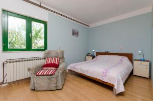 Postel nebo postele na pokoji v ubytování Apartments Luka
