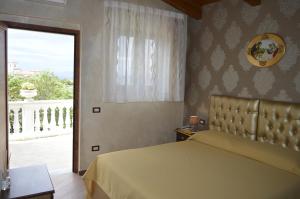 En eller flere senger på et rom på Villa Catiè