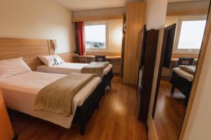Letto o letti in una camera di ibis Concepcion