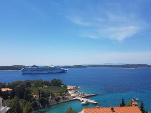 a cruise ship is docked in a harbor at J&B Holiday House Hvar in Hvar