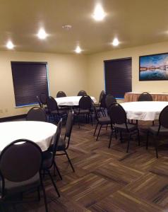 a conference room with tables and chairs in it at Aspen Suites Hotel Sitka in Sitka