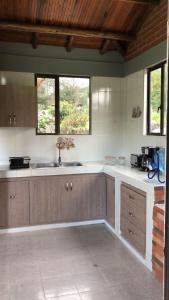 a kitchen with a sink and a counter top at Chalet la Bonita in El Encano