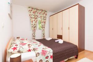 Posteľ alebo postele v izbe v ubytovaní Apartment Petea
