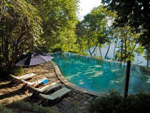 Bazén v ubytování The Menjangan by LifestyleRetreats nebo v jeho okolí