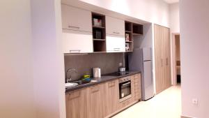 Kuchyň nebo kuchyňský kout v ubytování Casa Bella Deluxe Apartments